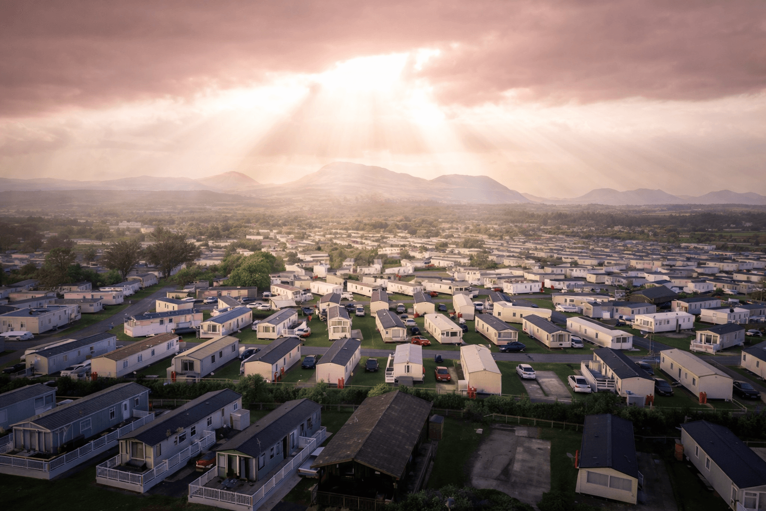 Aerial view of a large caravan park at sunset